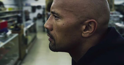 The Rock takes a thoughtful moment to consider a catchphrase as good as 'Boots to Asses'.