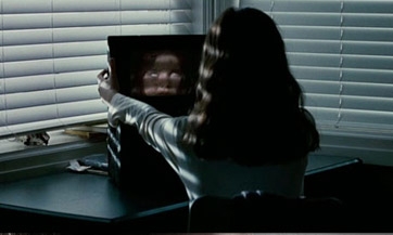 Is she Skyping herself? Oh! This is an evil twin movie. I get it.